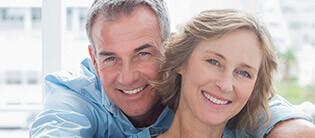Older couple with perfect healthy smile