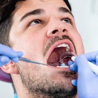 person getting their teeth cleaned