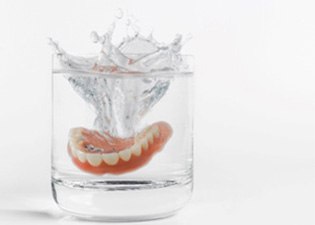 Dentures in a glass of water