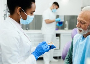 Male patient inquiring about new dentures