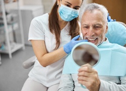 a patient smiling representing how dental implants work in Marlton
