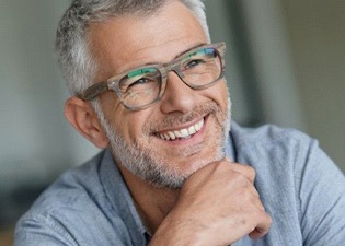 smiling elderly man with glasses