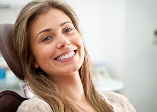 smiling young woman in the dental treatment chair
