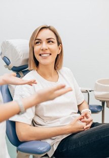 a dental patient smiling during an initial consultation 