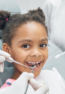 a child undergoing a dental checkup near Cherry Hill