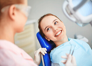 Young woman smiling in dental chair