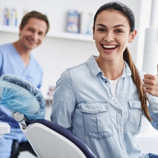 Dental patient giving thumbs up after ozone therapy in Marlton