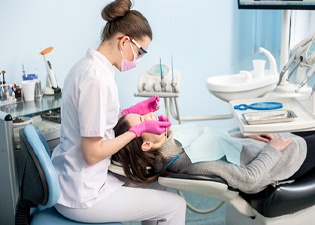 A dental hygienist doing a dental cleaning