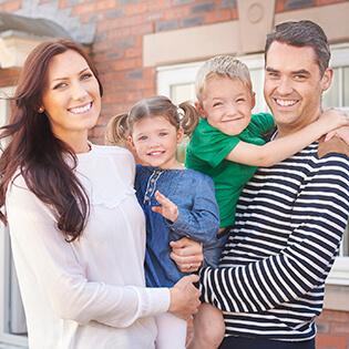 Young family with beautiful smiles