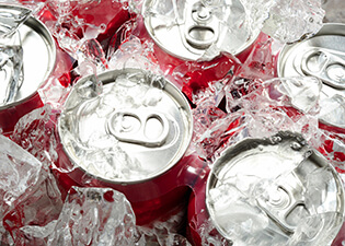 Soda can tops covered in ice