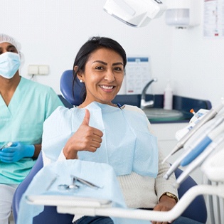 Woman giving thumbs up after nitrous oxide sedation in Marlton