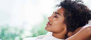 Female dental patient relaxing on couch