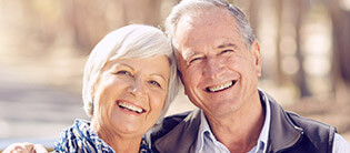 Happy older couple with healthy smiles