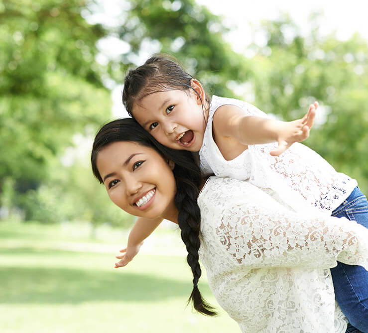 Happy mom and daughter smiling