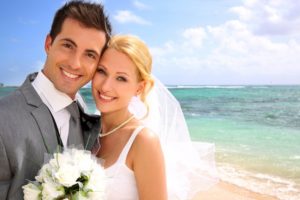 Smiling bride and groom