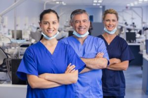 Marlton dentist team members wearing clean scrubs inside during COVID-19