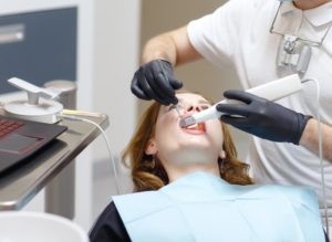 Dentist in Marlton using digital impression system for female patient