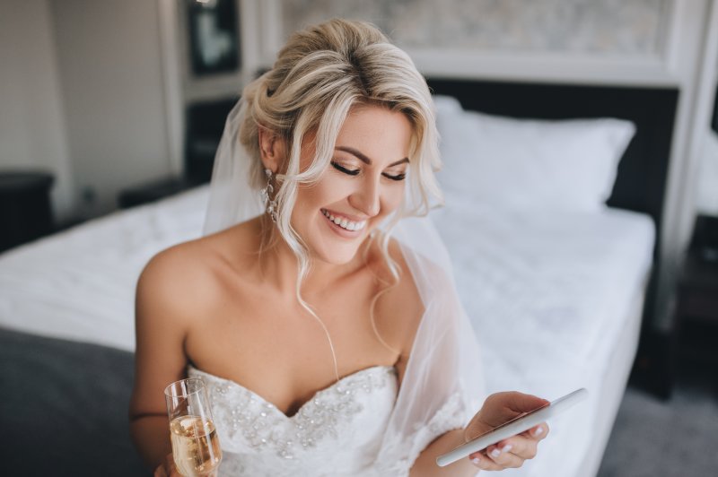 Bride with white teeth smiling on the morning of her wedding