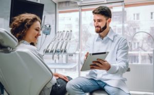 young woman at a dental implant consultation 